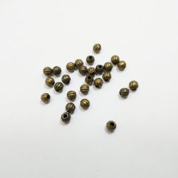 Alternative view of Bolitas de metal rayadas