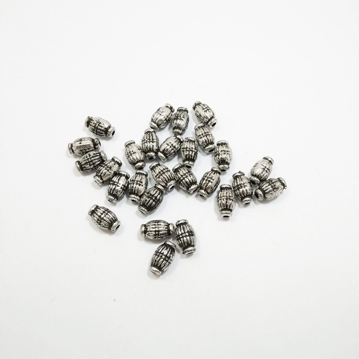 Separador plastico niquel oval rayado x10grs