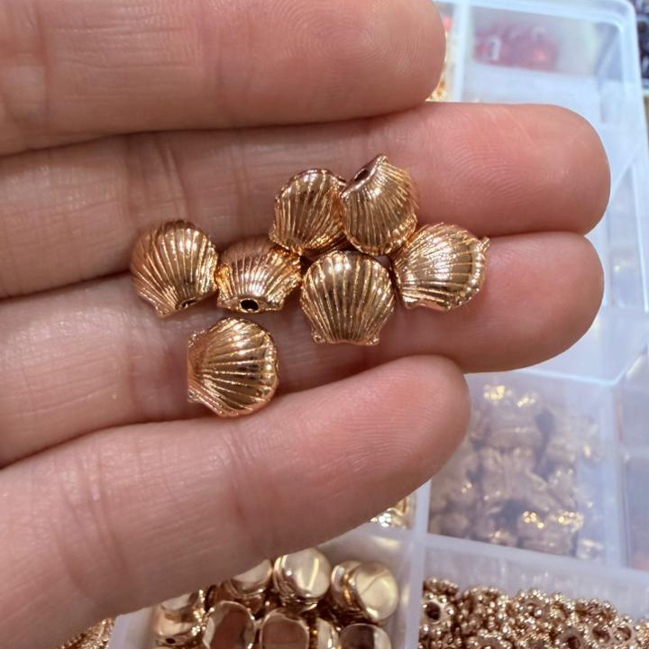 Separador metal ostra dorado x10u